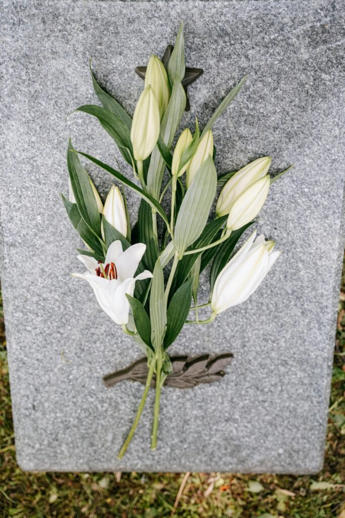 AI visibility funeral homes - white memorial lilies representing compassionate death care services